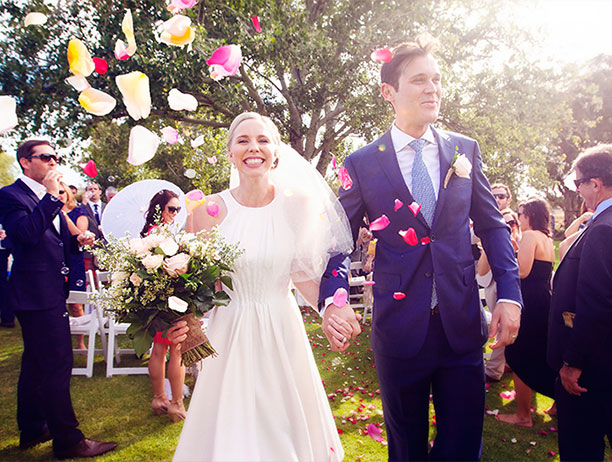 Wedding party celebrating with confetti