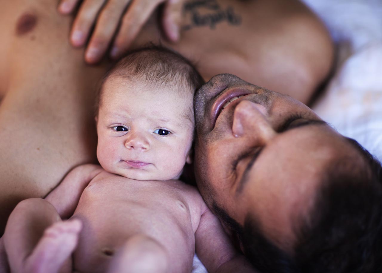 Parents holding their newborn