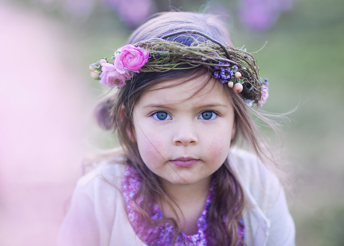 Girl among flowering trees