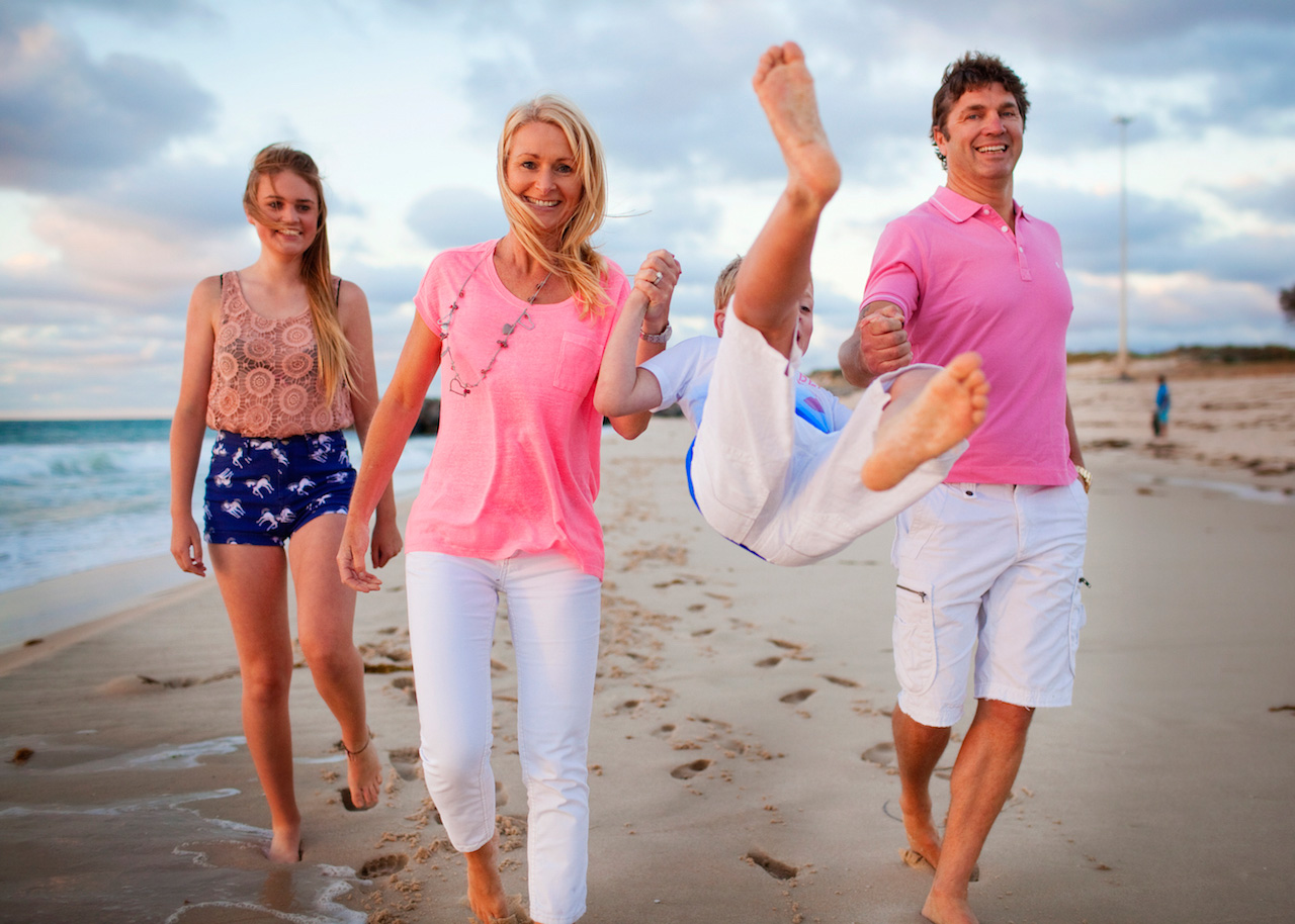 Family walking together at the beach