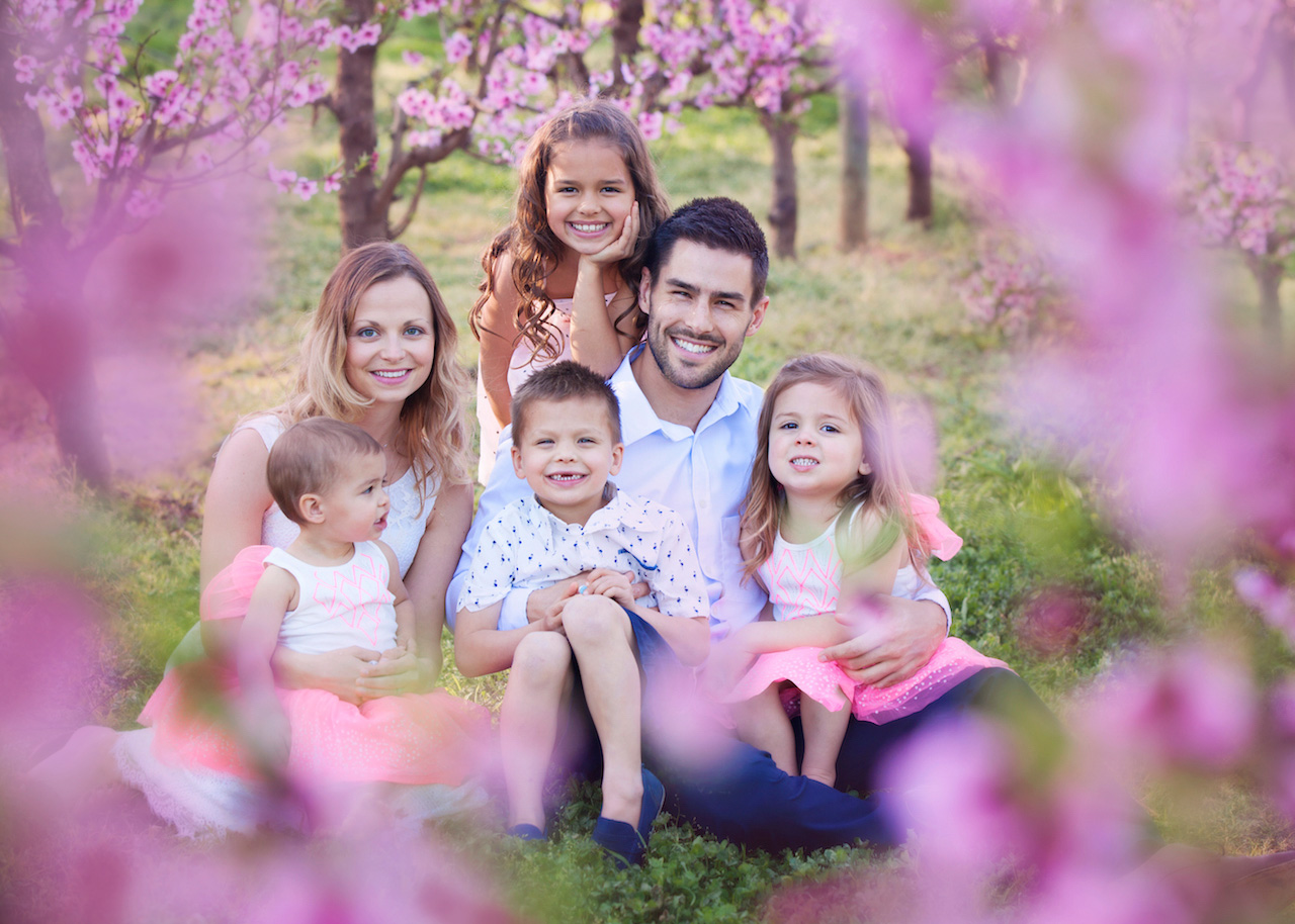 Family portrait among pink blossoms