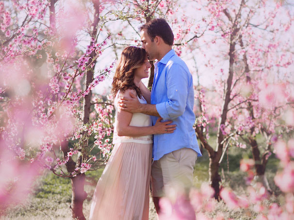 Couple among flowering trees
