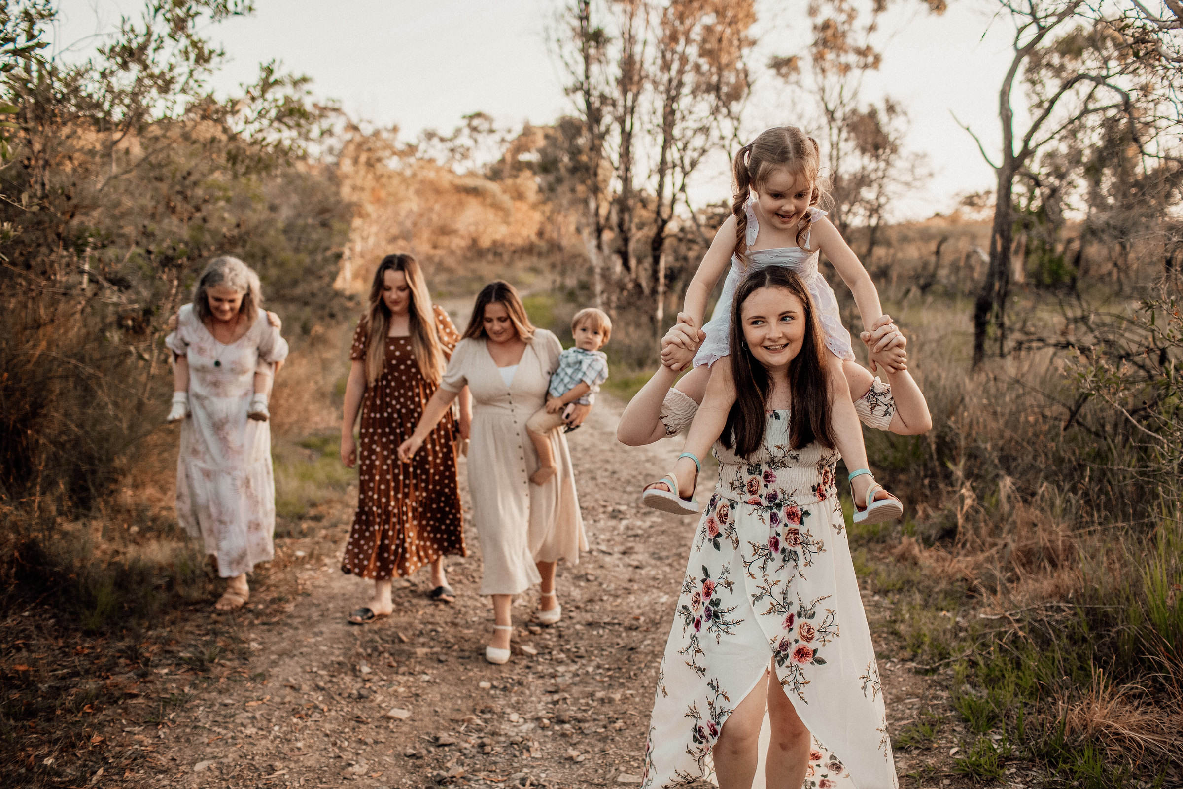 Family group walking along a bushland track
